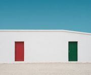 A white building with a red door