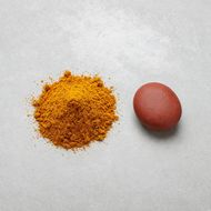 Orange spice powder on grey